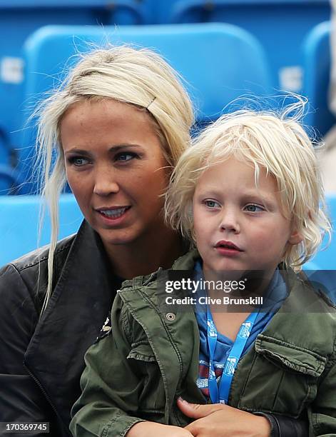 Bec Hewitt, wife of Lleyton Hewitt of Australia, with their son Cruz during the Men's Singles second round match against Grigor Dimitrov of Bulgaria...