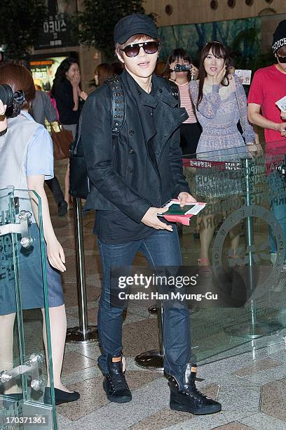 Kim of South Korean boy band Infinite is seen on departure at Gimpo International Airport on June 12, 2013 in Seoul, South Korea.