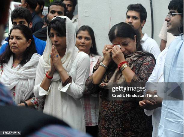 Bollywood actress Priyanka Chopra with her mother Madhu and brother Siddharth during funeral of her father Ashok Chopra receive condolences from well...