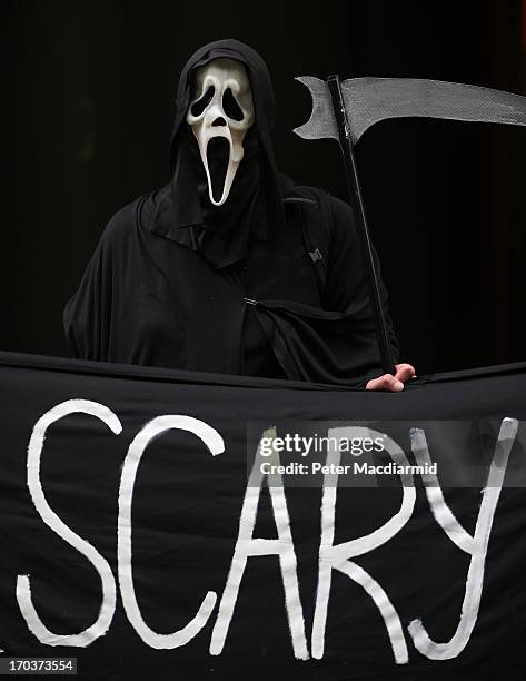 Protester dressed as the Grim Reaper stands outside arms manufacturer BAe Systems on June 12, 2013 in London, England. Protests are expected to take...