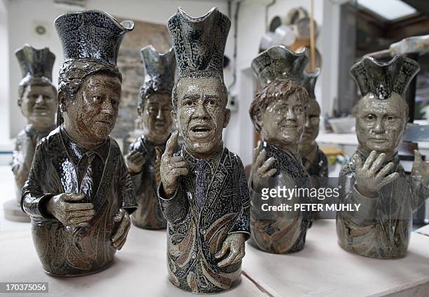 Toby jugs depicting the G8 leaders are pictured in the studio of Peter Meanley, Head of Ceramics at the University of Ulster, in Bangor, Northern...