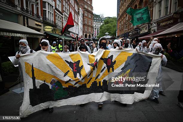 Arms trade protesters march towards Piccadilly on June 12, 2013 in London, England. Protests are expected to take place in London in the lead up to...