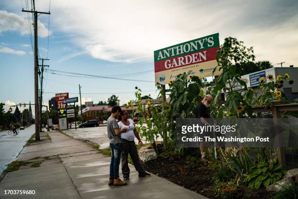 From left, Rafael Rodriquez DeQnna Chatfield and Gary McEnery volunteers, at Anthony's Garden, one of the SSJ Community Network neighborhood gardens...