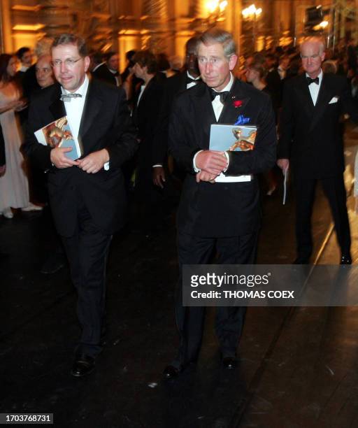 Britain's Prince Charles leaves the Opera Garnier 29 September 2004 in Paris, after a gala event to celebrate the centenary of the Entente-Cordiale,...