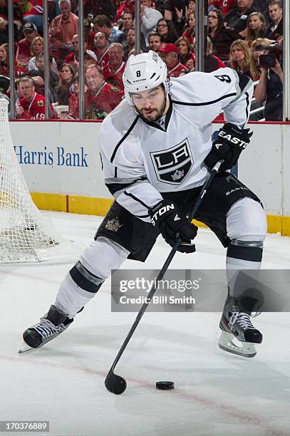 Drew Doughty of the Los Angeles Kings takes control of the puck in Game Five of the Western Conference Final against the Chicago Blackhawks during...