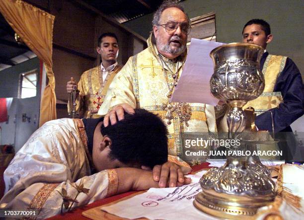 Carlos Romero is initiated as a preist into the Orthodox Catholic Church by US Archbishop Constantino in Ticuantepe, Nicaragua 27 April 2003. Carlos...