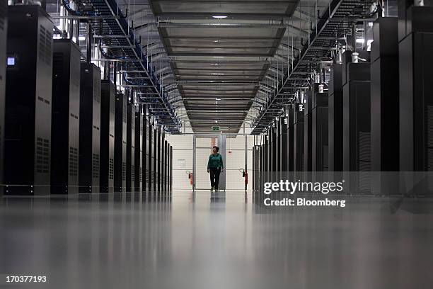 An employee stands in the server hall at Facebook Inc.'s new data storage center near the Arctic Circle in Lulea, Sweden, on Wednesday, June 12,...