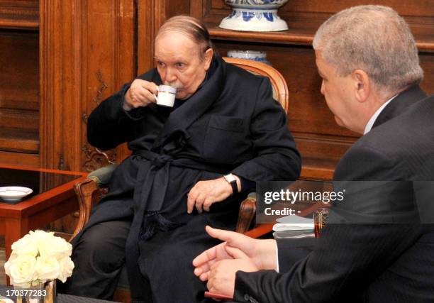 Photo obtained on June 12, 2013 from Algerian Press Service news agency shows Algeria's President Abdelaziz Bouteflika drinking tea as he receives...