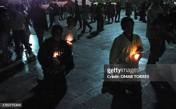 Catholic faithful walk on their knees 11 December towards he Guadalupe Basilica in Mexico City on the eve of the commemoration of the Virgin of...