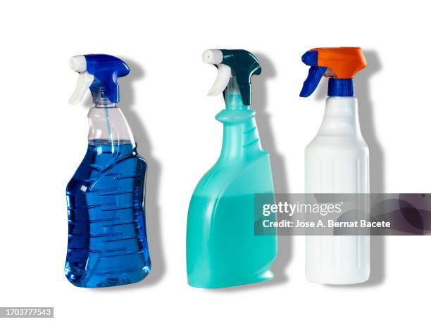 close-up of three spray bottle with cleaning or disinfectant fluid on a white background with a small shadow. - laundry-detergent-containers stock pictures, royalty-free photos & images