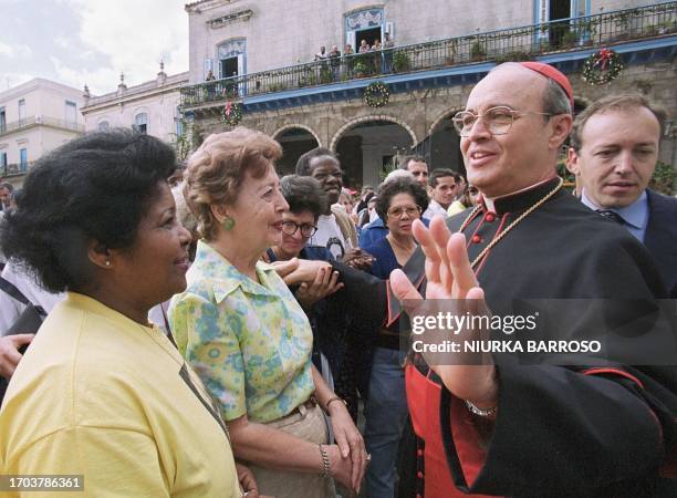 Cardinal Jaime Ortega greets Catholic faithful 25 December in Havana as they participate in the Vatican-sponsored "Open the Doors to Christ"...