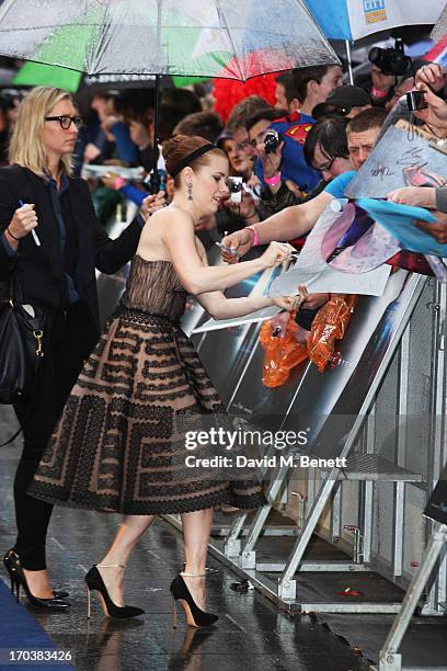 Actress Amy Adams signs autographs for fans as she attends the UK Premiere of 'Man of Steel' at Odeon Leicester Square on June 12, 2013 in London,...