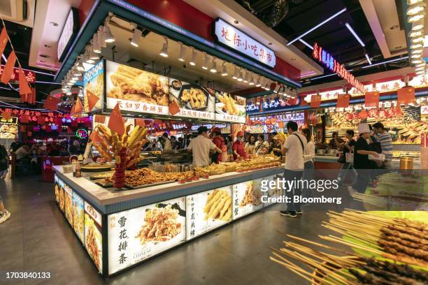 Food stall in Shanghai, China, on Tuesday, Oct. 3, 2023. China's Golden Week got off to a promising start as tourist trips and revenue jumped through...