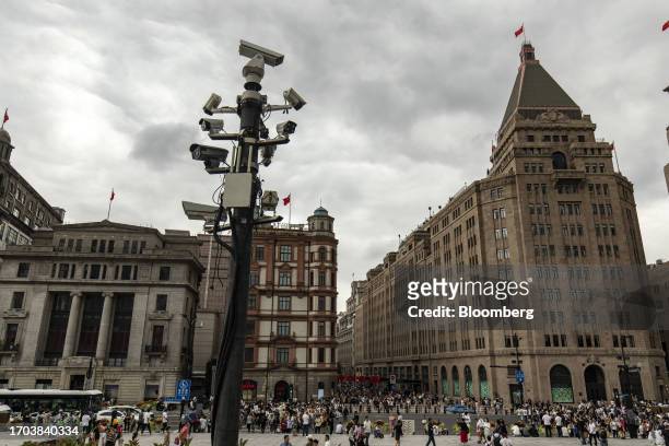 Surveillance cameras in front of buildings near the Bund in Shanghai, China, on Tuesday, Oct. 3, 2023. China's Golden Week got off to a promising...