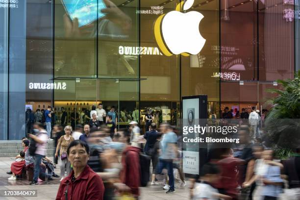 Pedestrians pass an Apple Inc. Store on Nanjing Road shopping street in Shanghai, China, on Tuesday, Oct. 3, 2023. China's Golden Week got off to a...