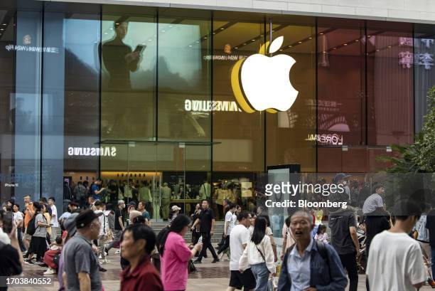 Pedestrians pass an Apple Inc. Store on Nanjing Road shopping street in Shanghai, China, on Tuesday, Oct. 3, 2023. China's Golden Week got off to a...