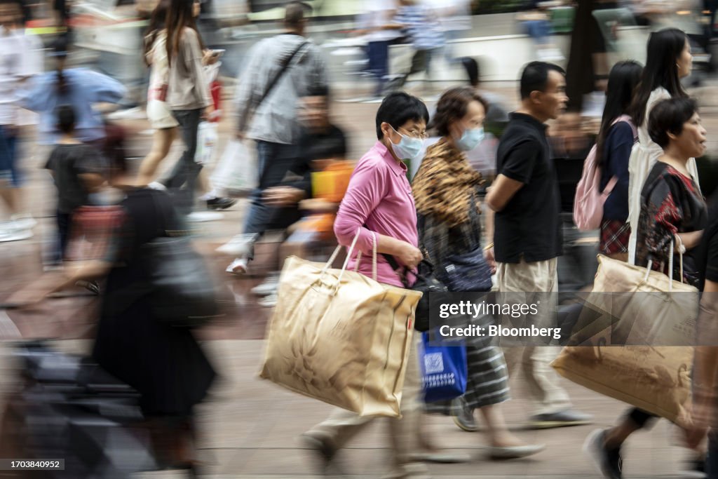 Shoppers in Nanjing Road As China Tourism Revenue More Than Doubled Over Holiday Weekend