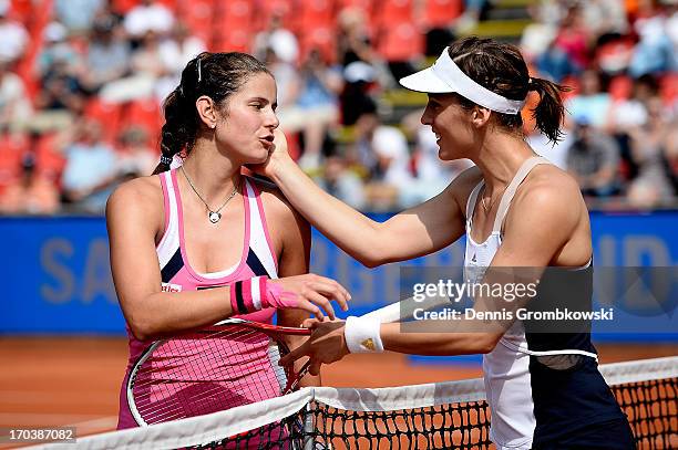 Julia Goerges and Andrea Petkovic of Germany hug after their second round match during day five of the Nuernberger Insurance Cup on June 12, 2013 in...