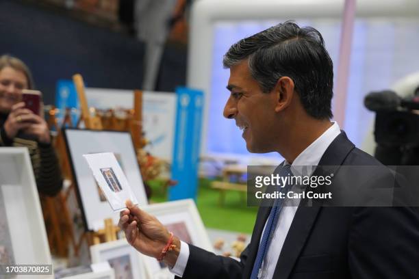 British Prime Minister Rishi Sunak tours the Exhibitor's Hall on Day 3 of the Conservative Party Conference on October 3, 2023 in Manchester,...