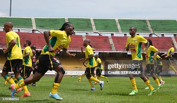 South African national football team players take part in a training session on June 12, 2013 at the Amadou Ahidjo stadium in Yaounde befor their...