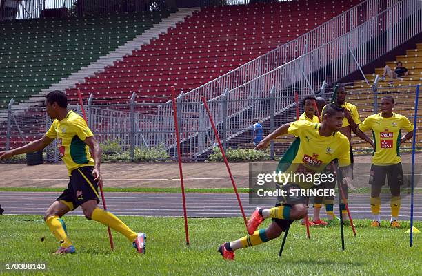 South African national football team players take part in a training session on June 12, 2013 at the Amadou Ahidjo stadium in Yaounde befor their...