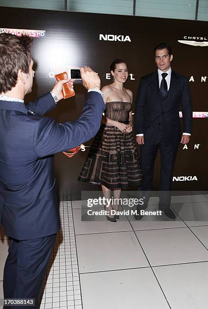 Director Zack Snyder takes a picture of Amy Adams and Henry Cavill attends the UK Premiere of 'Man of Steel' at Odeon Leicester Square on June 12,...