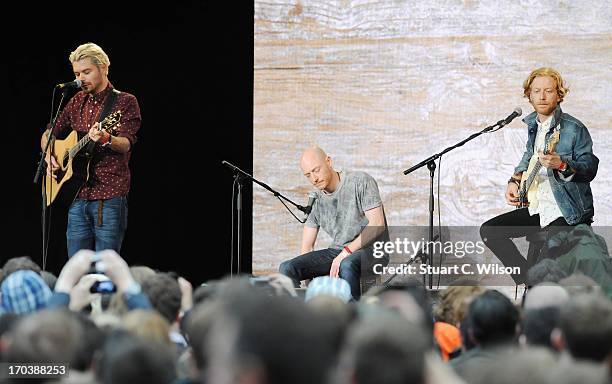 Simon Neil, Ben Johnston and James Johnston of Biffy Clyro performs at agit8 at Tate Modern, ONE's campaign ahead of the G8 on June 12, 2013 in...