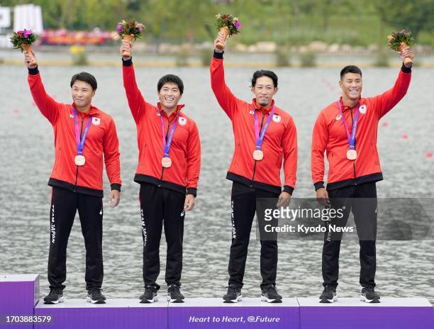Members of Japanese team celebrate after winning bronze in the men's kayak four 500-meter final at the Asian Games in Hangzhou, China on Oct. 3, 2023.