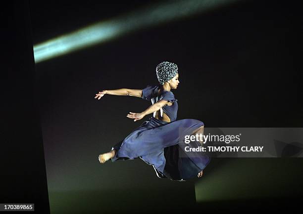 Dancer Belen Pereyra of the Alvin Ailey American Dance Theater performs part of "Four Corners" during a dress rehearsal June 12, 2013 as the Alvin...