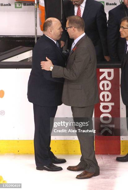 Head coach Claude Julien of the Boston Bruins shakes hands with head coach Dan Bylsma of the Pittsburgh Penguins after the Bruins defeated the...