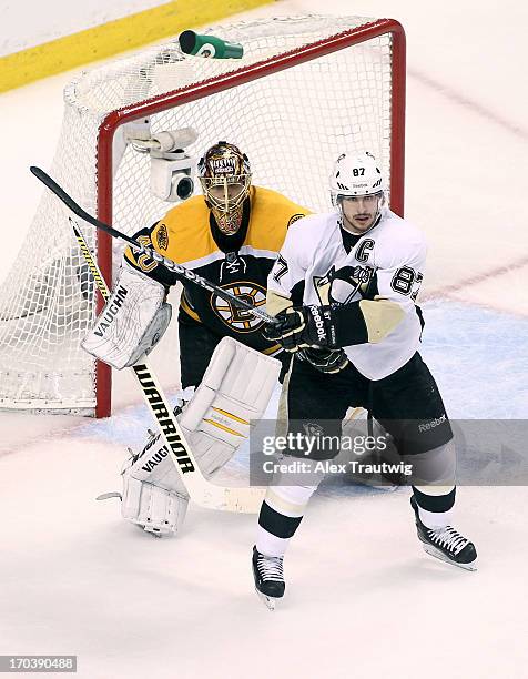 Sidney Crosby of the Pittsburgh Penguins fights for position in front of Tuukka Rask of the Boston Bruins in Game Four of the Eastern Conference...