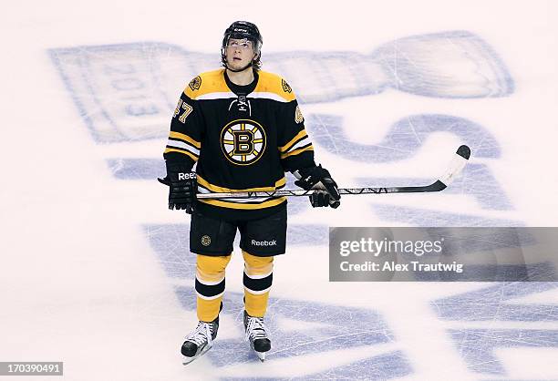 Torey Krug of the Boston Bruins looks on against the Pittsburgh Penguins in Game Four of the Eastern Conference Final during the 2013 Stanley Cup...