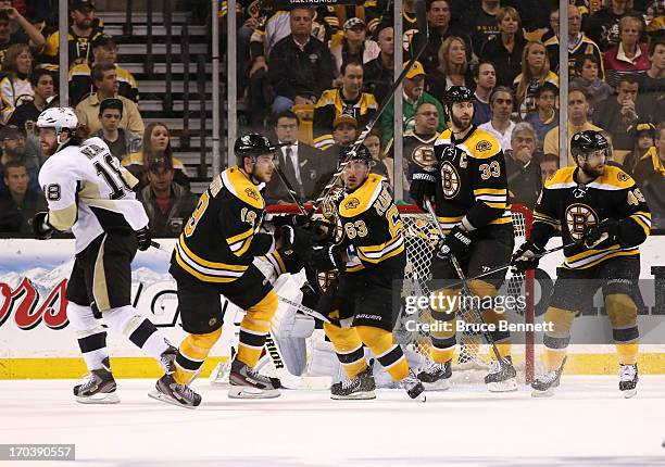 Nathan Horton, Brad Marchand, Zdeno Chara and Rich Peverley of the Boston Bruins skate on the ice against the Pittsburgh Penguins in Game Four of the...
