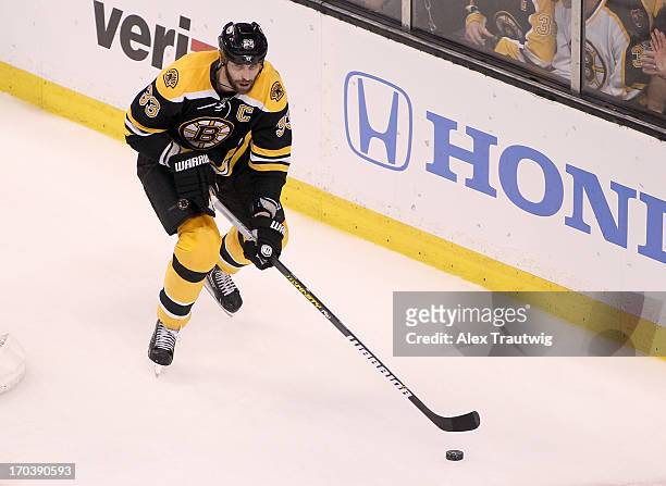 Zdeno Chara of the Boston Bruins handles the puck against the Pittsburgh Penguins in Game Four of the Eastern Conference Final during the 2013...