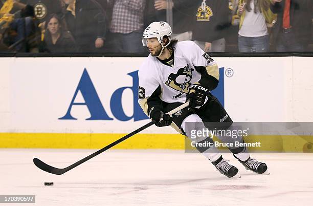 Kris Letang of the Pittsburgh Penguins handles the puck against the Boston Bruins in Game Four of the Eastern Conference Final during the 2013 NHL...