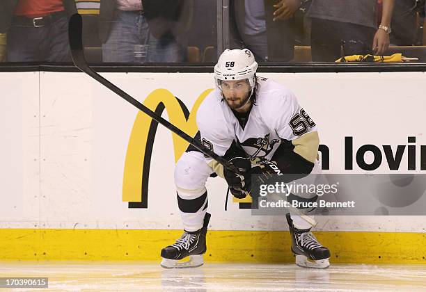 Kris Letang of the Pittsburgh Penguins looks on against the Boston Bruins in Game Four of the Eastern Conference Final during the 2013 NHL Stanley...