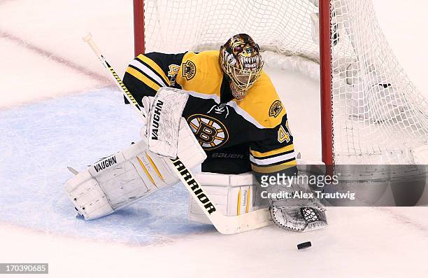 Tuukka Rask of the Boston Bruins makes a save against the Pittsburgh Penguins in Game Four of the Eastern Conference Final during the 2013 Stanley...