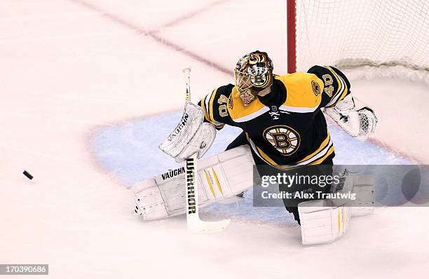 Tuukka Rask of the Boston Bruins makes a save against the Pittsburgh Penguins in Game Four of the Eastern Conference Final during the 2013 Stanley...