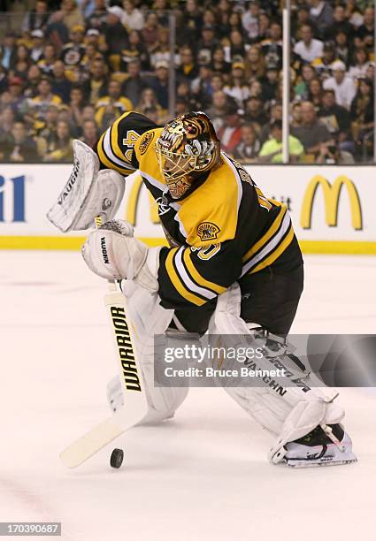 Tuukka Rask of the Boston Bruins clears the puck against the Pittsburgh Penguins in Game Four of the Eastern Conference Final during the 2013 NHL...