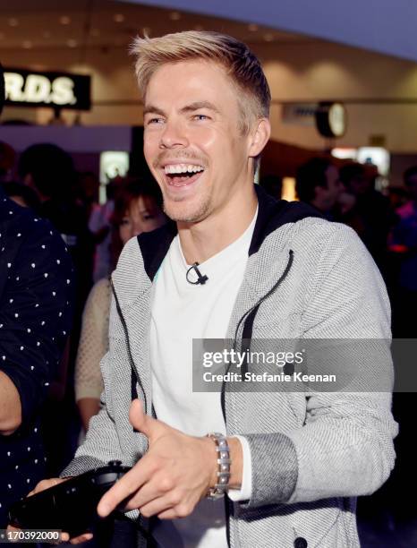 Personality Derek Hough attends Nintendo's booth to sample games for Wii U and Nintendo 3DS at the 2013 E3 Gaming Convention at Los Angeles...