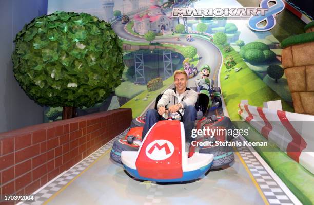 Personality Derek Hough visits the world of Mario Kart 8 available for Wii U in December while attending Nintendo's booth at the 2013 E3 Gaming...