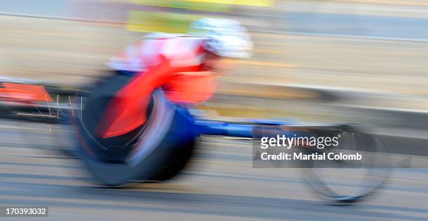 handicaped biker in movement - wheelchair race stock pictures, royalty-free photos & images
