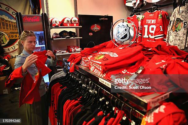 Customers shop for merchandise in the Blackhawks Store on Michigan Avenue in the Loop on June 12, 2013 in Chicago, Illinois. The Chicago Blackhawks...