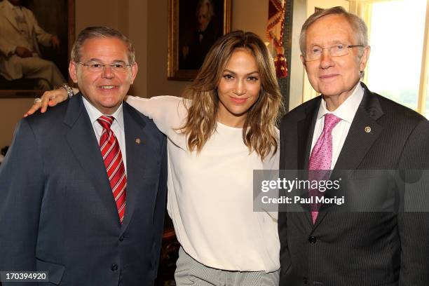 Senator Robert Menendez, NUVOtv Chief Creative Officer Jennifer Lopez and Senate Majority Leader Harry Reid meet on Capitol Hill on June 12, 2013 in...