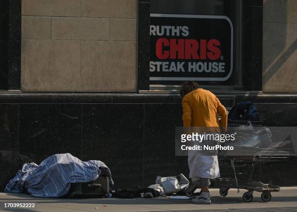 Homeless woman on the street in downtown Edmonton, on September 29 in Edmonton, Alberta, Canada. Canada's downtowns, vital for economic growth and...