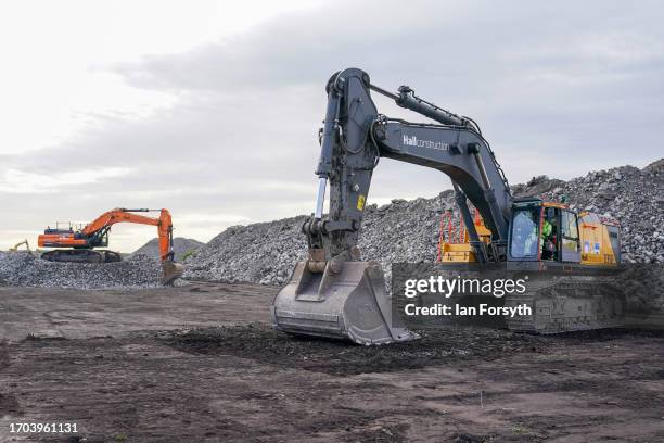 Plant machinery operates during a ceremony to mark the ground-breaking of the Net Zero Teesside project on September 27, 2023 in Redcar, England. The...