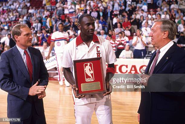 Playoffs: Chicago Bulls Michael Jordan victorious, holding National Basketball Association's Defensive Player of the Year Award trophy before Game 4...
