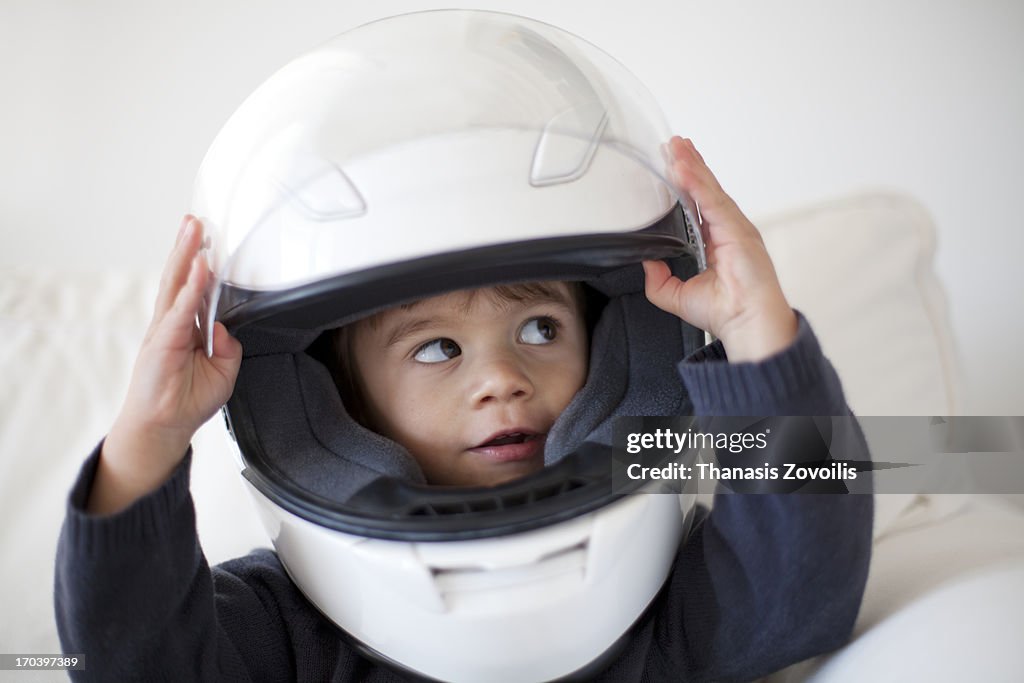 Portrait of a small boy wearing a helmet