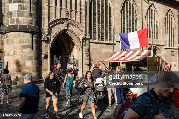 Customers at crepe stall in Nuremberg, Germany, on Monday, Oct. 2, 2023. German inflation plunged to its lowest level in two years after the effect...