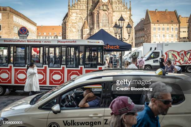 Taxi driver waits for a fare in Nuremberg, Germany, on Monday, Oct. 2, 2023. German inflation plunged to its lowest level in two years after the...